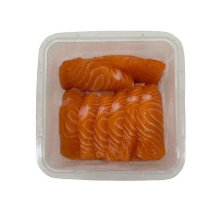 fresh salmon back loin sashimi with visible marbling, arranged in a clear plastic tray for retail and wholesale 